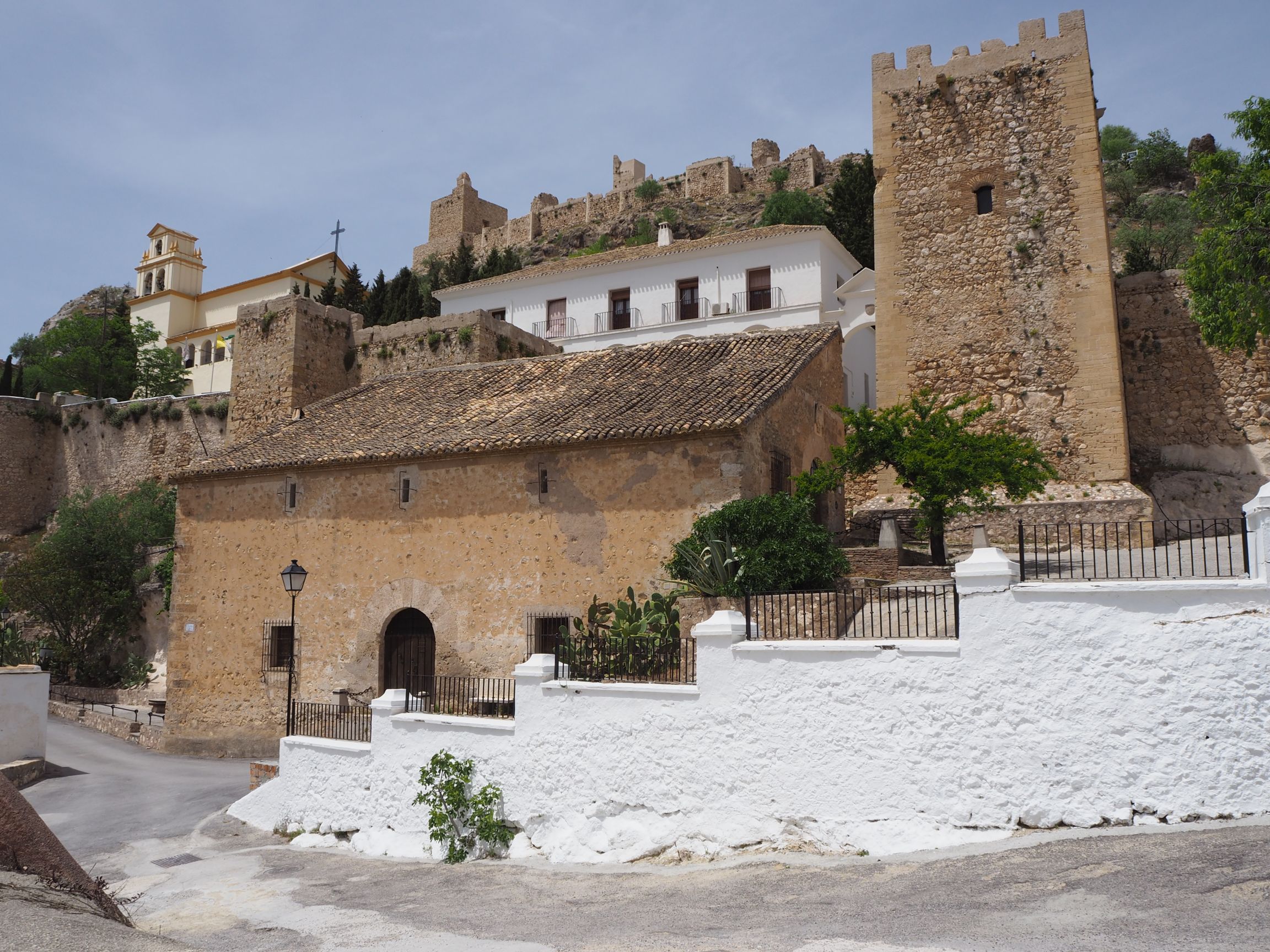 Moclin castle with the Sanctuary of Christ of the Cloth Church to the left